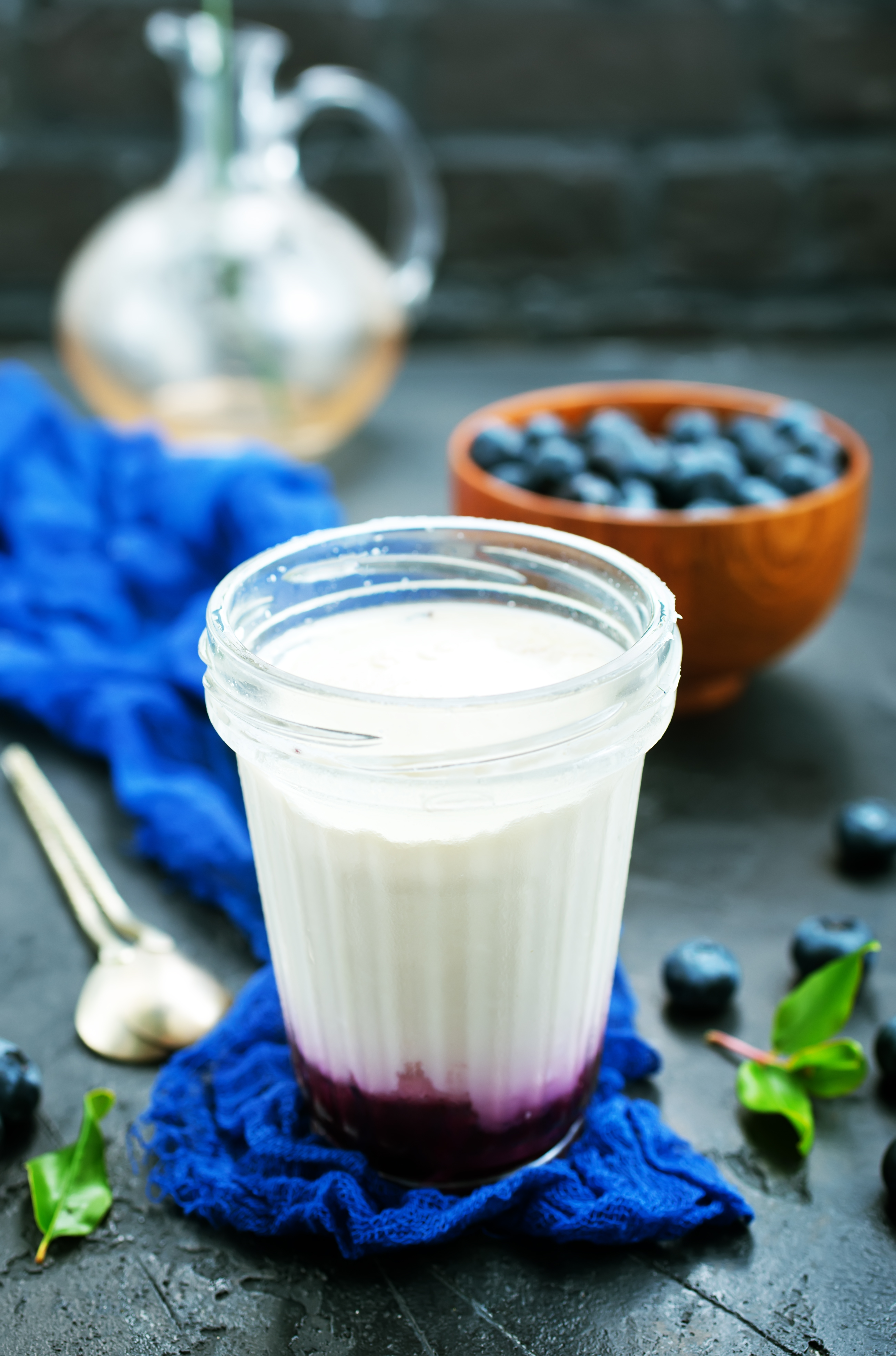 Kefir with blueberry compote in a jar